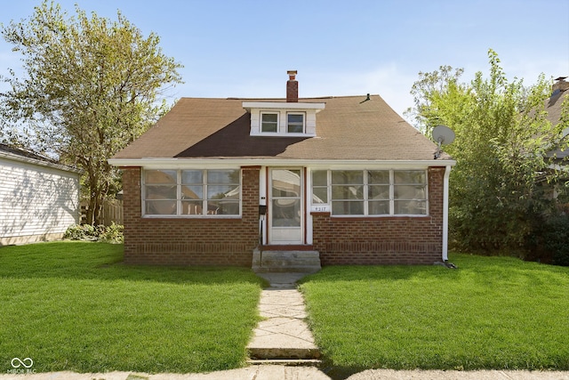 bungalow with a front lawn