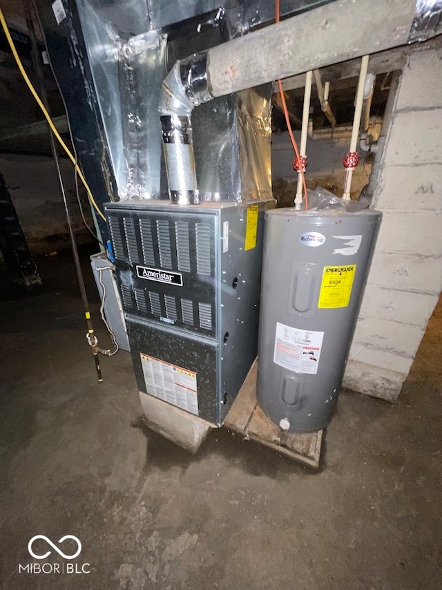 utility room featuring water heater