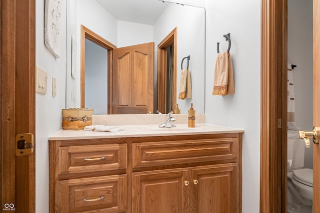 bathroom with vanity and toilet