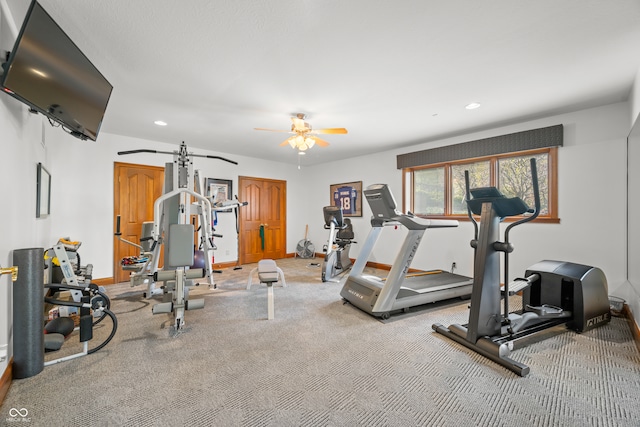 workout room with carpet and ceiling fan