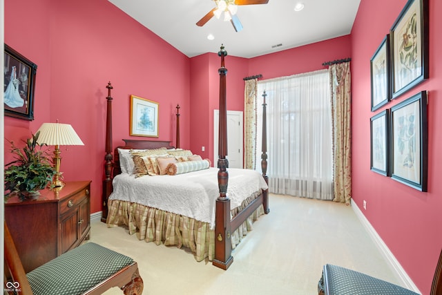 bedroom featuring light colored carpet and ceiling fan