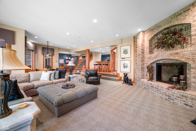 living room featuring carpet flooring and a fireplace