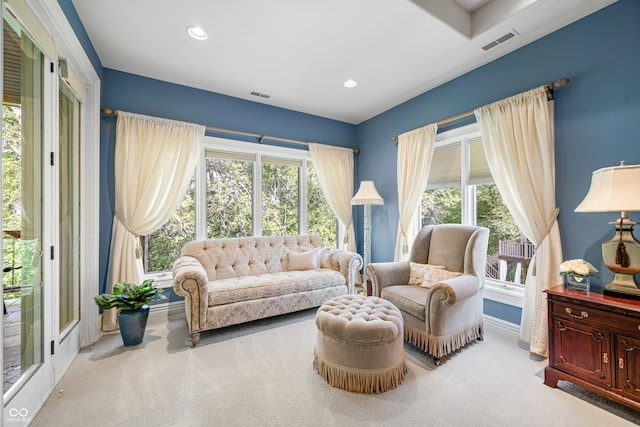 sitting room with light colored carpet