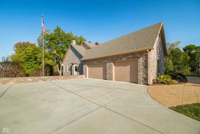 view of side of home with a garage