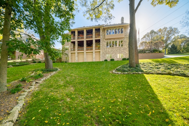 rear view of house with a lawn