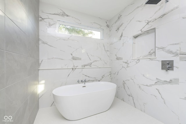 bathroom featuring a tub to relax in and tile walls