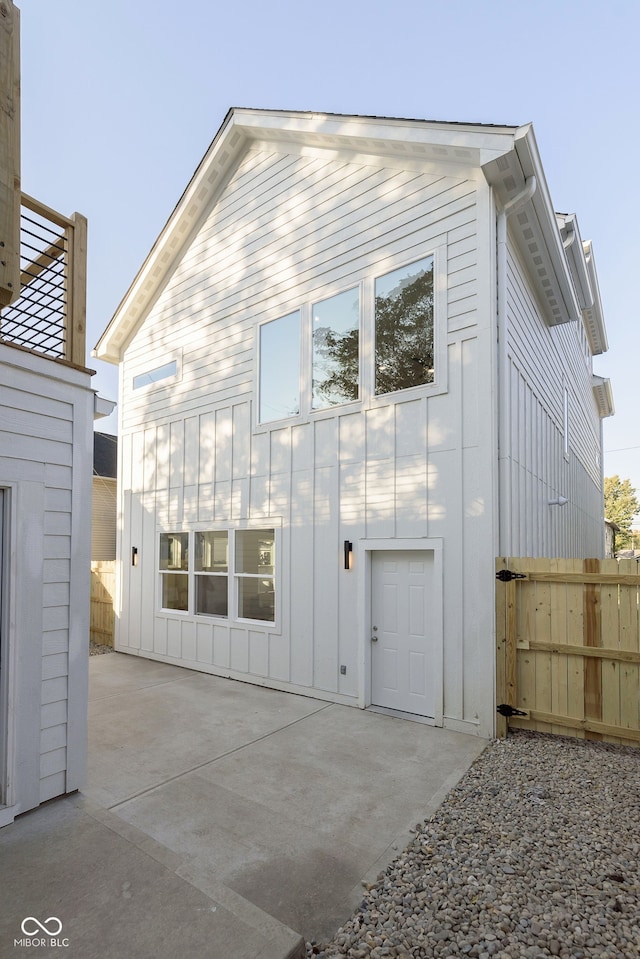 back of property with a patio