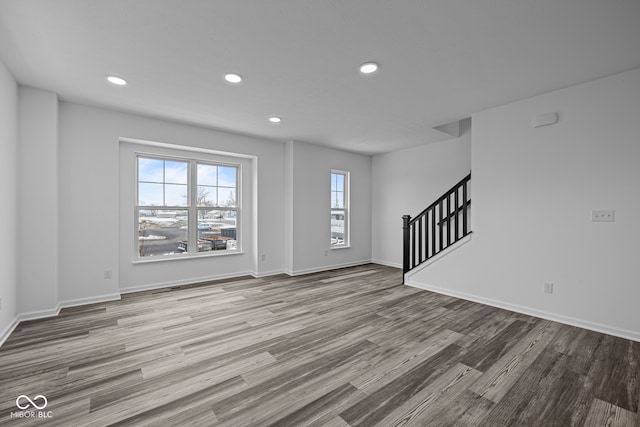 unfurnished living room with light wood-type flooring