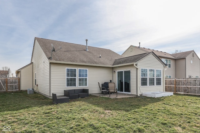 rear view of property featuring central air condition unit, a patio area, a lawn, and an outdoor hangout area