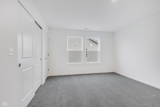 unfurnished bedroom with carpet