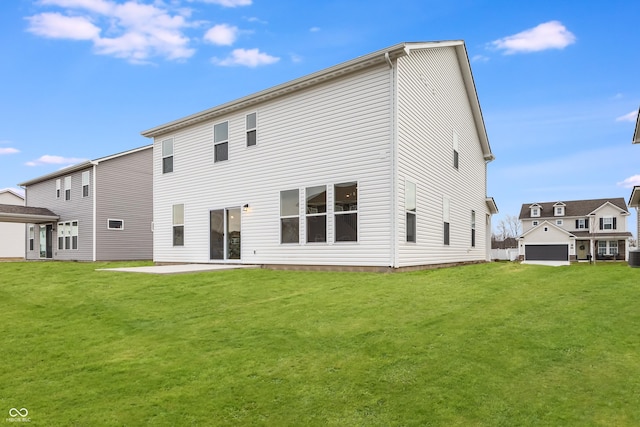 back of house featuring a lawn