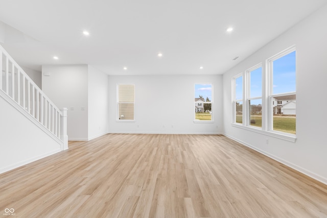 unfurnished living room featuring light hardwood / wood-style flooring