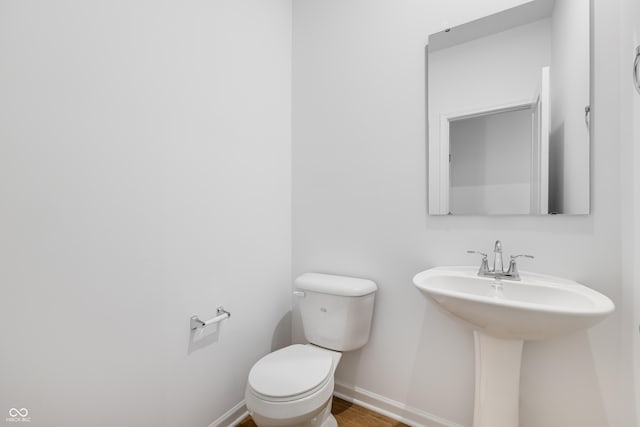 bathroom with toilet and sink