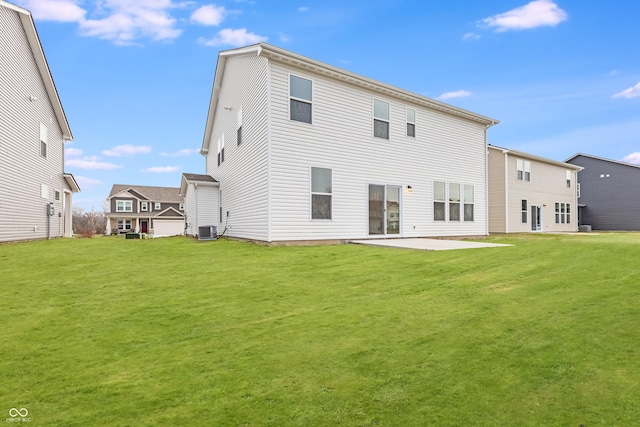 back of property featuring central air condition unit, a yard, and a patio