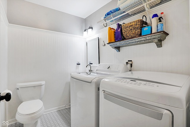 laundry area featuring tile patterned floors and washer and clothes dryer