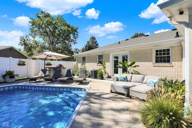 view of swimming pool with an outdoor hangout area and a patio