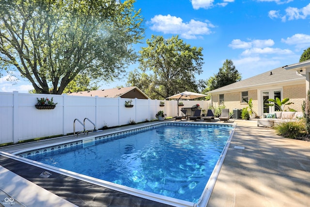 view of pool featuring a patio