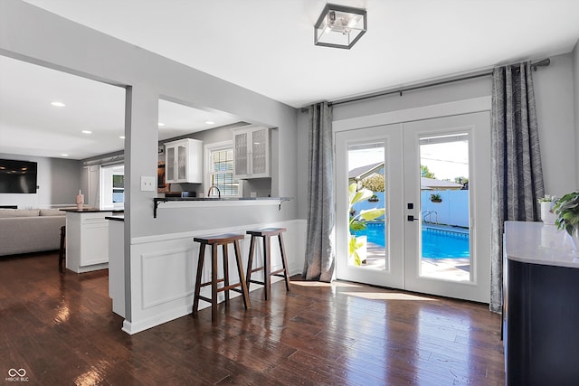 doorway to outside featuring dark wood-type flooring and french doors