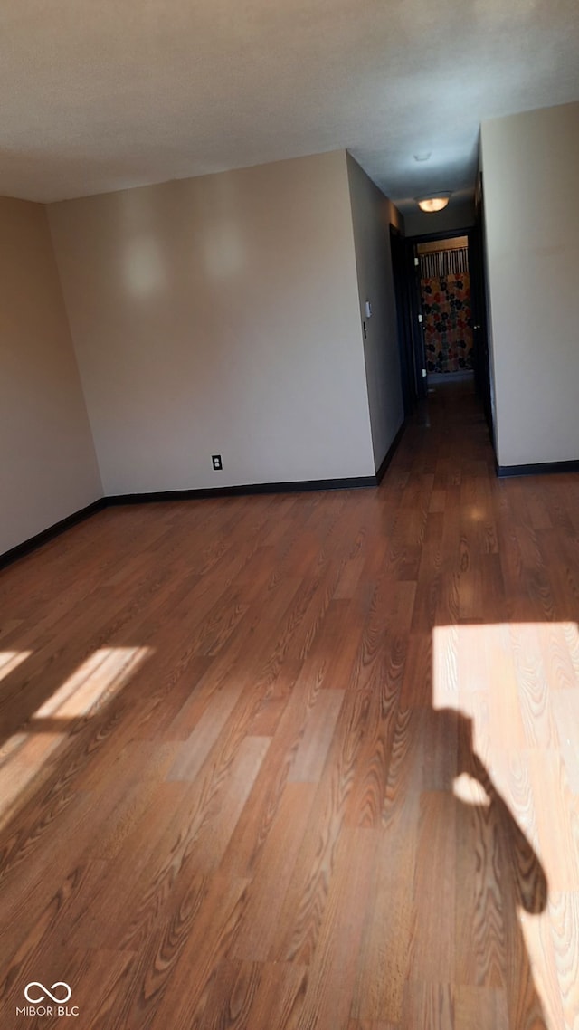 empty room featuring hardwood / wood-style flooring