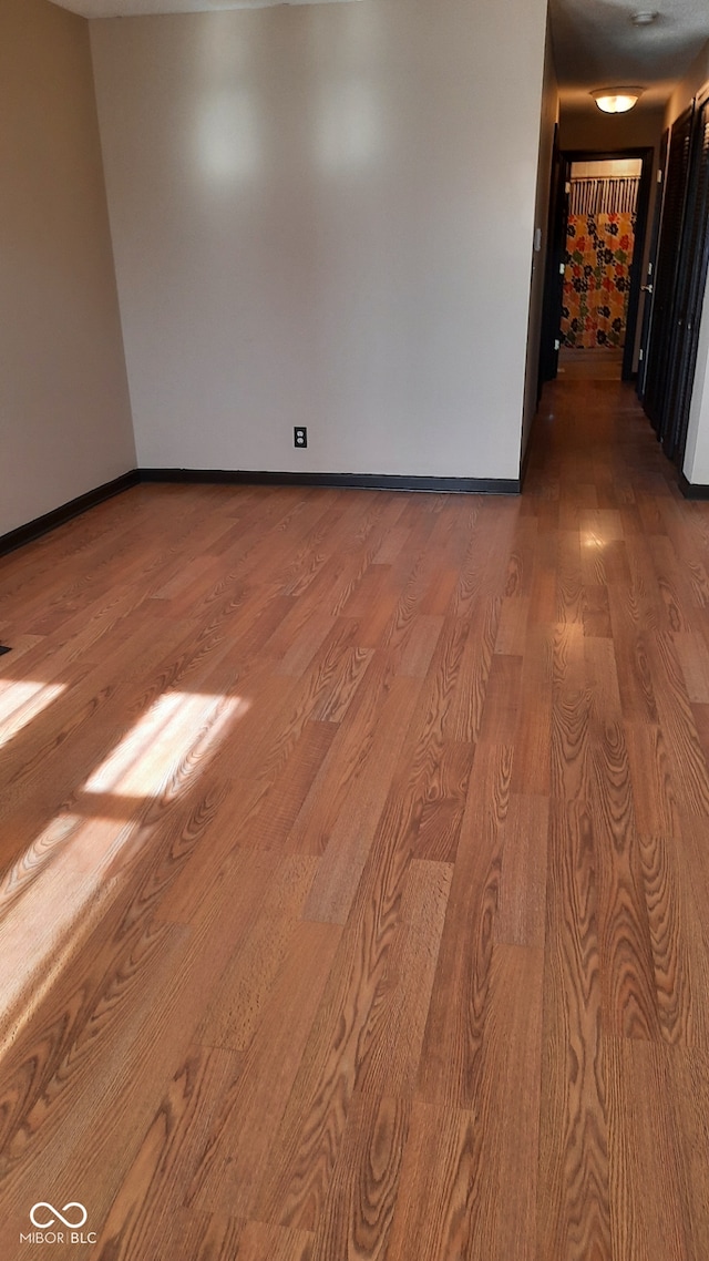 unfurnished room featuring hardwood / wood-style floors