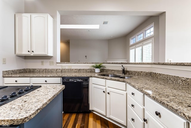 kitchen featuring sink, dark wood-type flooring, white cabinetry, black appliances, and light stone countertops