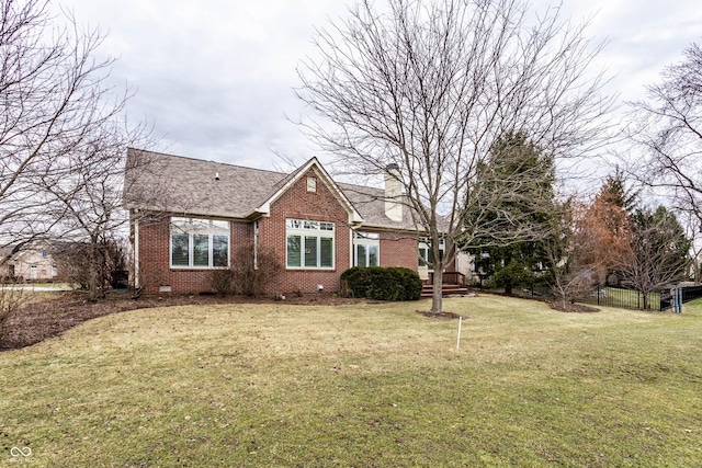 view of side of home featuring a yard