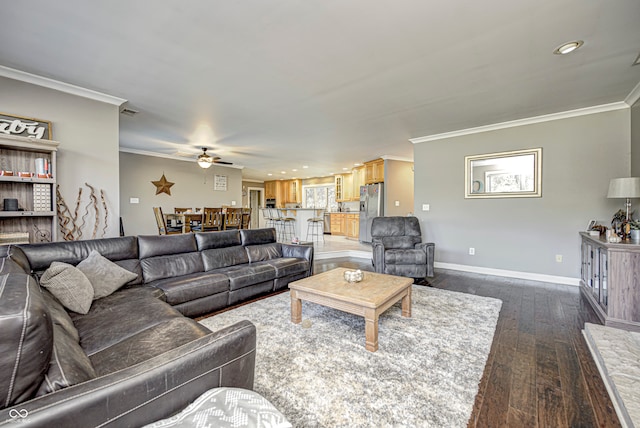 living area with baseboards, ceiling fan, ornamental molding, dark wood-type flooring, and recessed lighting