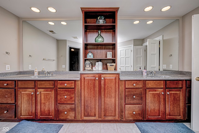 bathroom with recessed lighting, visible vents, and vanity