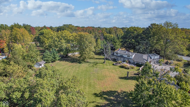 birds eye view of property with a forest view