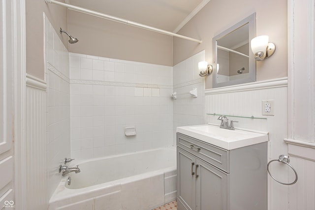 full bathroom with a wainscoted wall, shower / tub combination, and vanity