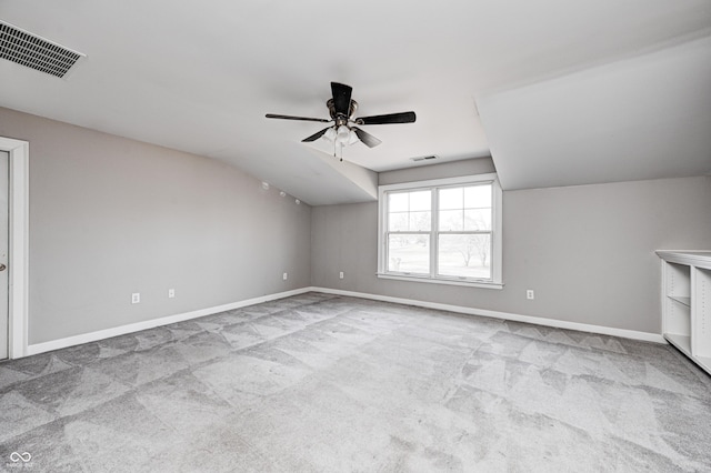 additional living space featuring carpet, visible vents, and vaulted ceiling