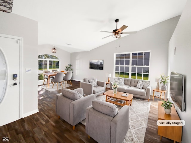 living room featuring ceiling fan, vaulted ceiling, and dark hardwood / wood-style floors