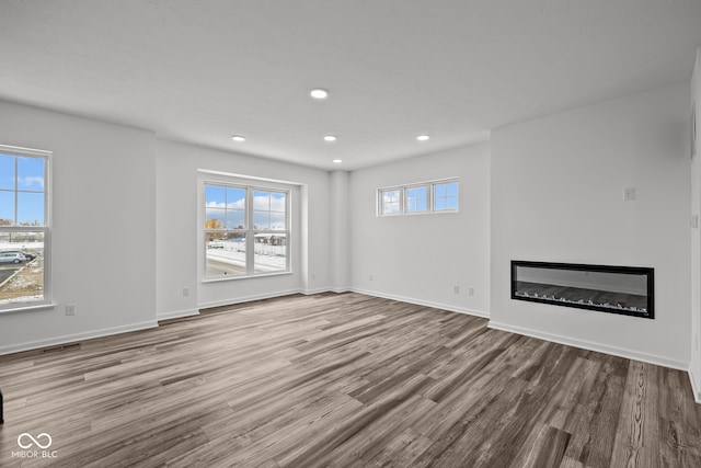 unfurnished living room featuring light wood-type flooring