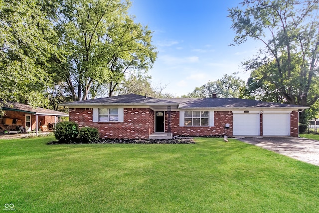 single story home featuring a front lawn and a garage