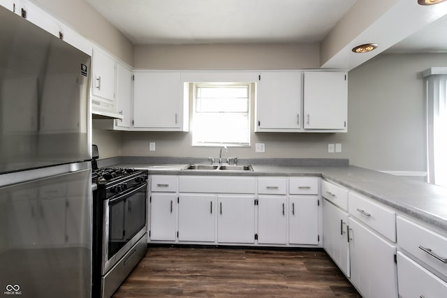 kitchen with stainless steel appliances, extractor fan, sink, and white cabinetry