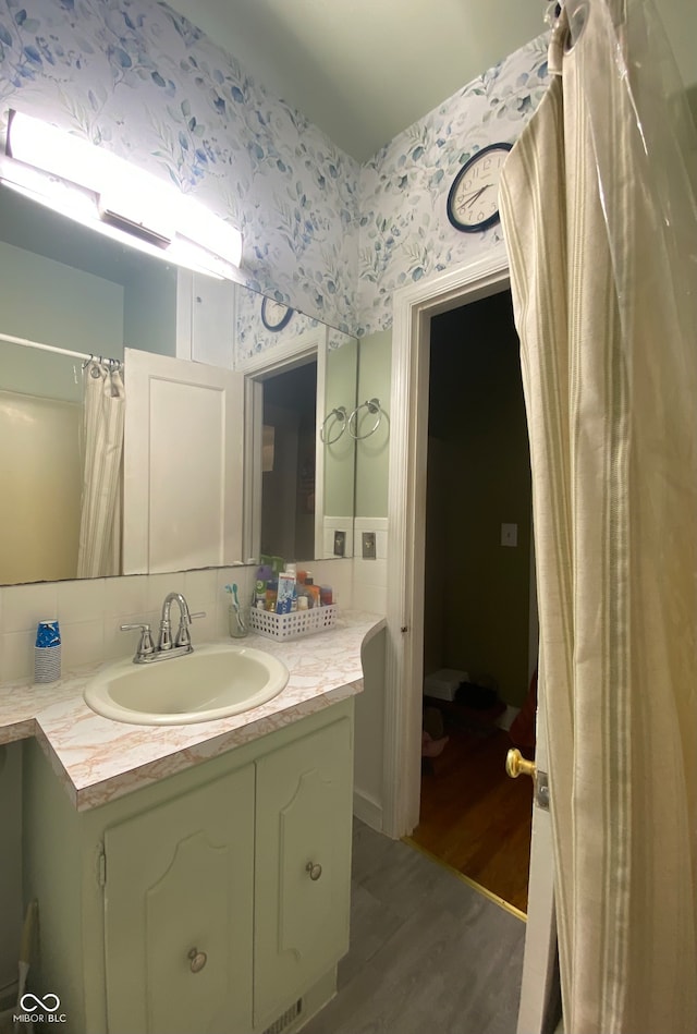 bathroom featuring wood-type flooring and vanity