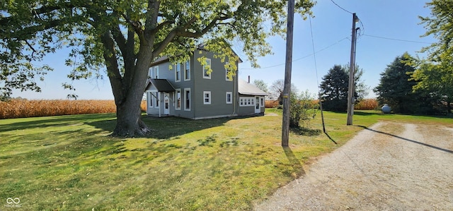 view of home's exterior with a yard