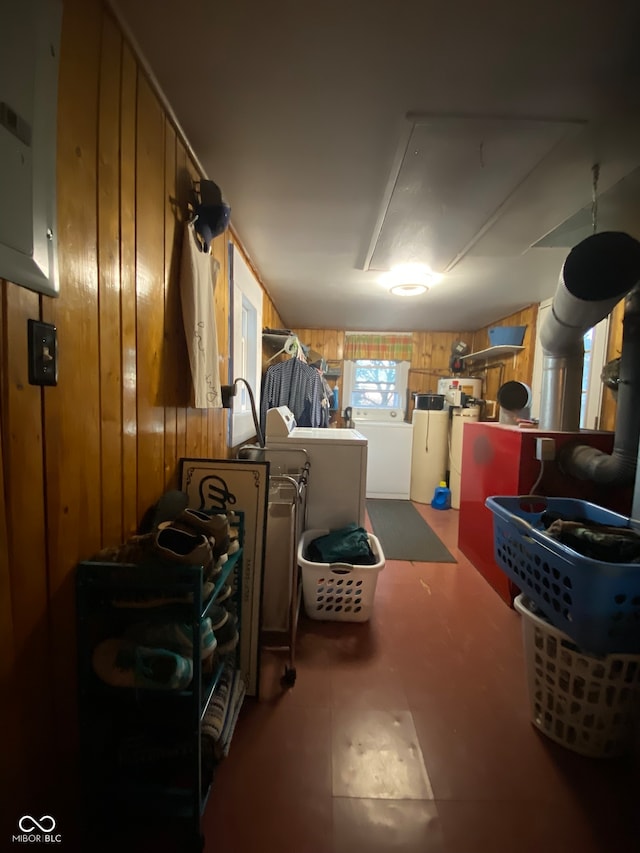 interior space with washer / clothes dryer and wooden walls