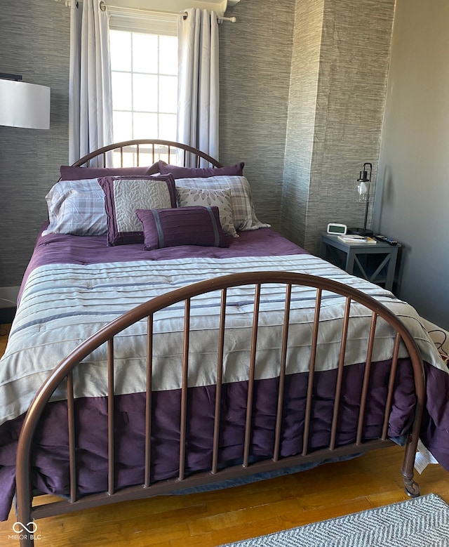 bedroom with hardwood / wood-style floors