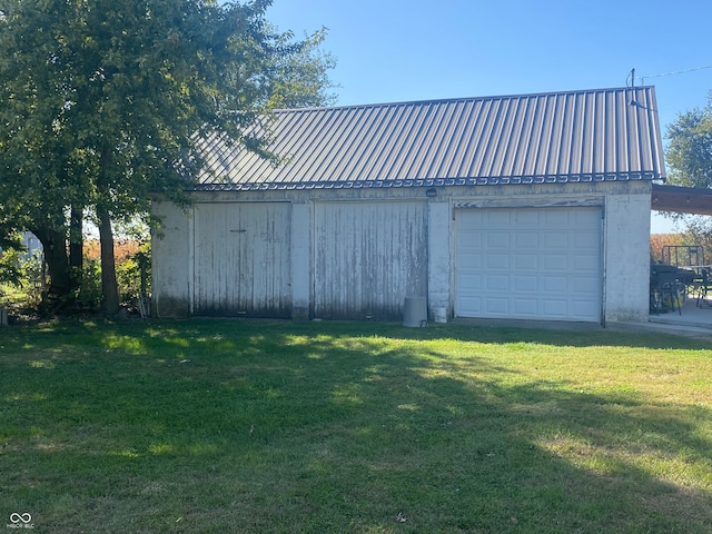 garage with a yard