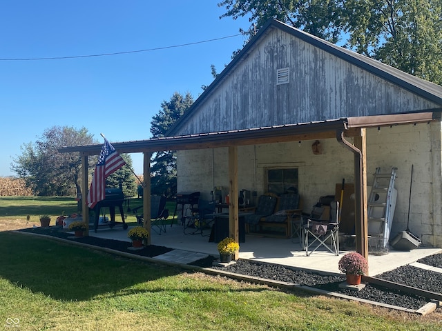 rear view of property with a yard