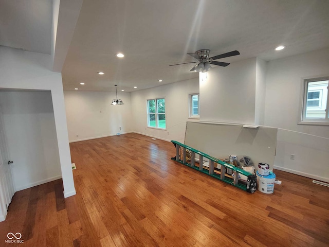 unfurnished living room with hardwood / wood-style flooring and ceiling fan