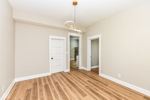 unfurnished room featuring hardwood / wood-style floors