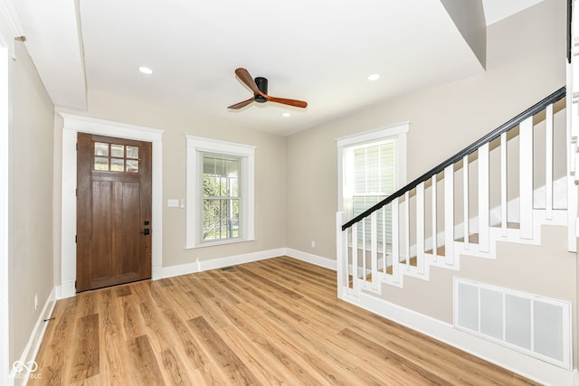 entryway with ceiling fan, light hardwood / wood-style floors, and a healthy amount of sunlight