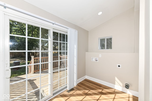 clothes washing area with washer hookup, hardwood / wood-style flooring, and electric dryer hookup