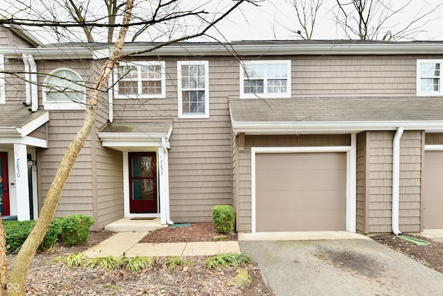 townhome / multi-family property featuring a garage