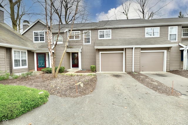 7854 Harbour Isle, Indianapolis, IN 46240 - townhome / multi-family property with a garage and aphalt driveway