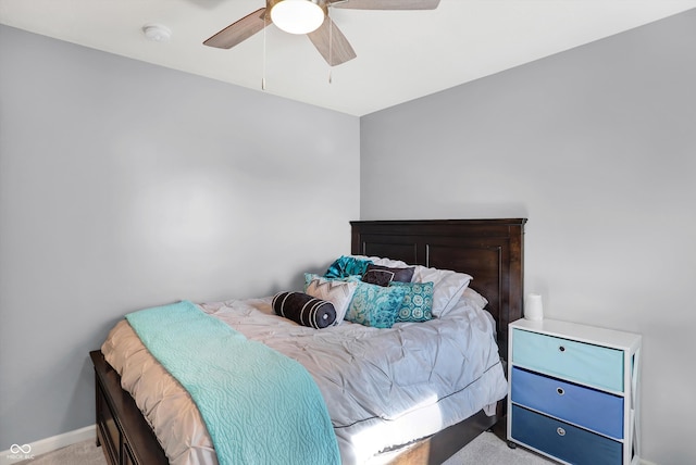 bedroom featuring light colored carpet and ceiling fan