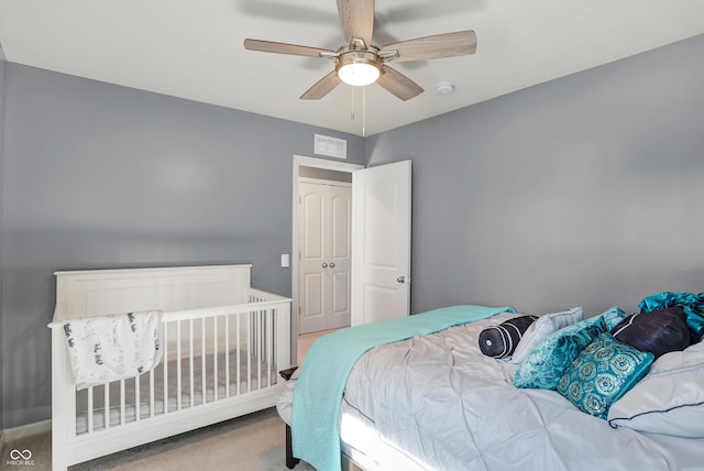 carpeted bedroom featuring ceiling fan