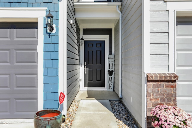 entrance to property featuring a garage